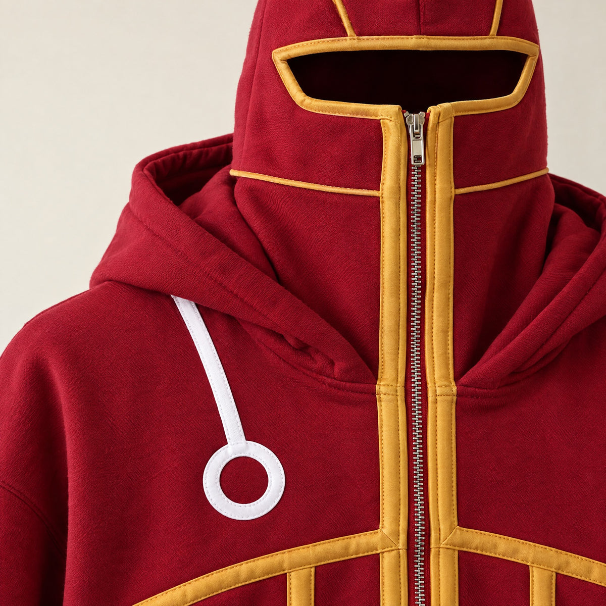 Close-up of the zip-up mask and gold piping on the SSG Hoodie